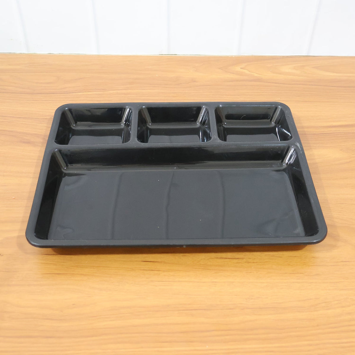 Easy-clean plastic 4-compartment meal tray, ideal for hygienic portion control.