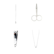 Close-up of a sharp surgical-grade stainless steel nail clipper from the set.