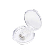 A hand gently holding the lightweight silicone anti-snore nose clip.