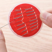 Essential stitching kit components like needles and thread organized