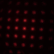 A galaxy projector creating a romantic starry night effect in a dimly lit room.