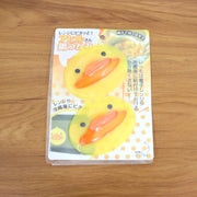 Front view of duck shape silicone hot pot holder providing heat protection