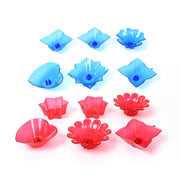 Assorted multi-shape plastic diyas creating a shimmering glow for festive decor.