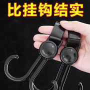 Close-up of the durable ABS plastic stroller hook with adjustable strap.