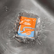 Drain cleaner sachet ready for pouring into kitchen sink drain
