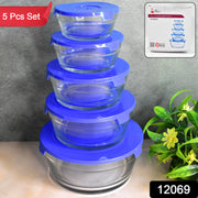 Stackable glass bowls with matching lids, showcasing various sizes for storage.