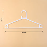 White plastic clothes hanger supporting a hanging garment