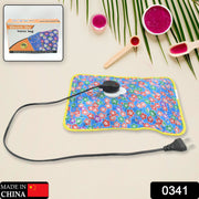 Rechargeable hot water bag plugged in for quick heating, showing the charging port.