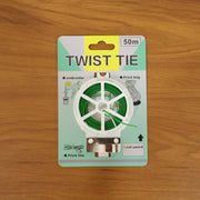 Green flexible twist tie wire roll with built-in cutter in hand