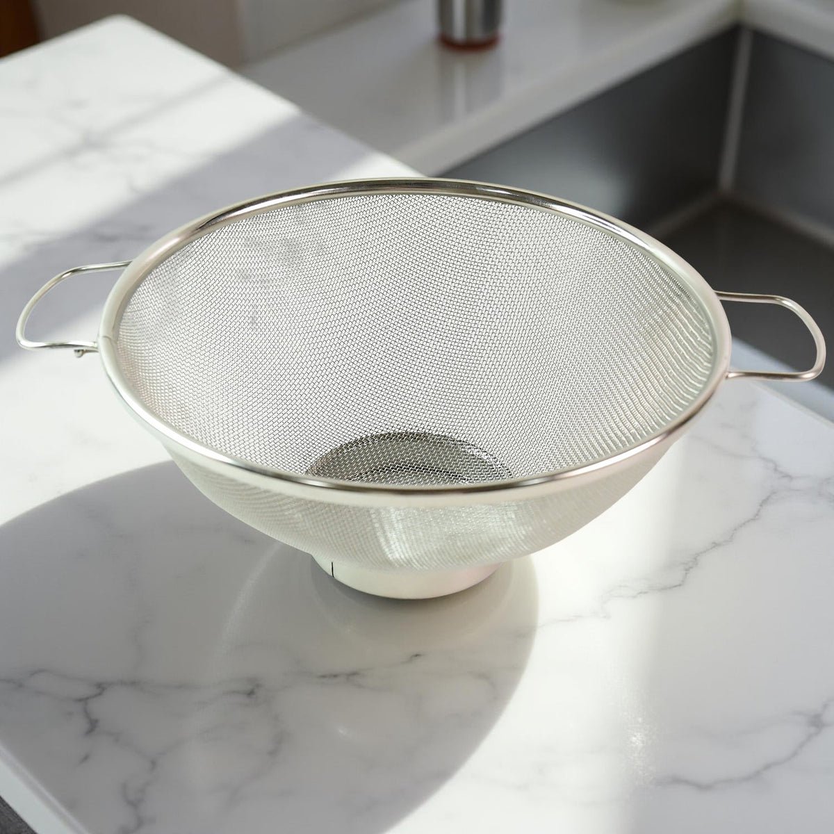 Dual ergonomic welded handles on stainless steel colander for easy grip