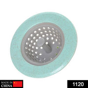 Close-up of a durable silicone sink strainer with a handlebar and fine mesh holes.