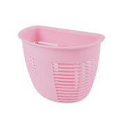 Kitchen organizer basket mounted next to a sink, holding sponges and dishwashing liquid.