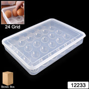 Top-down view of empty 24-grid clear plastic egg tray