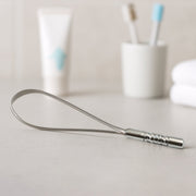 MintGuard Steel Tongue Cleaner displayed with its product packaging.