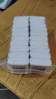 Detailed view of a bamboo cotton swab's pure cotton tip.