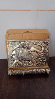 Lifestyle shot of the elegant wooden elephant key holder enhancing a modern home entryway.