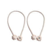 Non-magnetic pearl curtain tiebacks in use, adding a touch of elegance to living room decor.