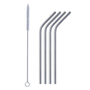 Bent stainless steel straw elegantly placed in a clear drinking glass.