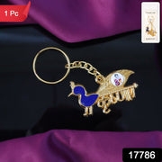 Close-up of Krishna enamel peacock design on metal keyring