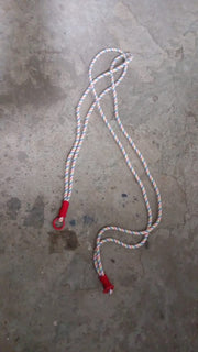 Lifestyle image showing a smartphone easily accessible via its phone lanyard from a bag.