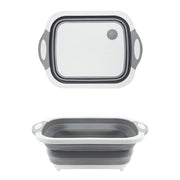 Compact foldable chopping board with dish rack and washing bowl features.