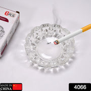 Clear round crystal glass ashtray featuring 4 convenient slots for cigars and cigarettes.