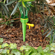 Set of six self-watering plant spikes by Tidy Roots, ready for multiple plants.