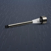 A complete silver and clear plastic solar LED spike light is shown horizontally on a dark blue textured surface.