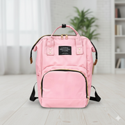 Tots Basics Diaper Bag Backpack in black, front view with multiple compartments.