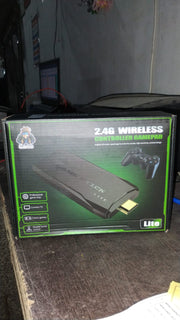 Complete package of the Spark Tots Wireless Gaming Console with controllers and accessories.
