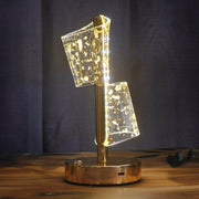 Modern decorative table lamp with golden base and warm LED light