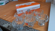 Decorated glass dessert cups, perfect for festive occasions and entertaining guests.