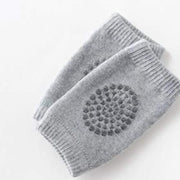 Toddler Knee Guard in wool knit, shown on a child's leg for protection.