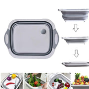 Foldable chopping board in use, converting to a dish rack for washing vegetables.