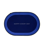 Oval shaped non-slip bath mat positioned on bathroom floor