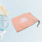 Compact folding travel storage bags ready for packing.