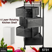 Close-up of the rotating metal mesh basket on the kitchen trolley, showing its ventilation.