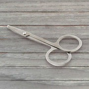Elegant compact nail clipper set with its clear storage case for easy access.