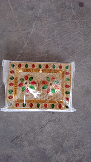 Vertical shot of the festive Raksha Bandhan Pooja Thali with kumkum holder.
