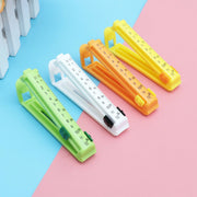Set of four vibrant food sealing clips with date dials, perfect for keeping food fresh in an Indian kitchen.