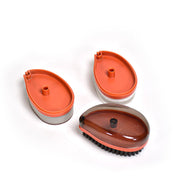 Compact wet and dry brush removing dirt from a fabric item.
