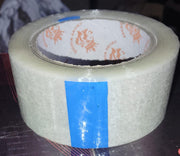 Roll of transparent cello tape, perfect for general purpose sealing.