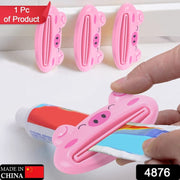 Portable multifunction laptop table with toothpaste squeezer for home or travel.
