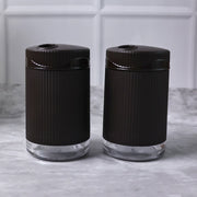Salt and pepper dispenser set featuring transparent bases for easy spice monitoring