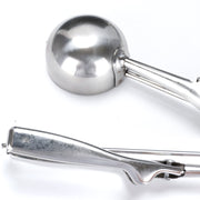 Wide head of the multi-purpose stainless steel scooper for easy portioning.