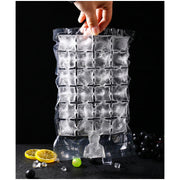 Hand holding a frozen disposable ice cube bag, ready for use.
