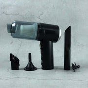 Close-up of the Mini Car Vacuum's nozzle and brush attachments.
