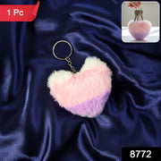 Heart shaped plush keychain attached securely to bag zipper