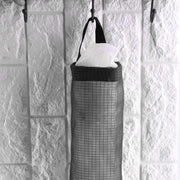 Back view of the waste bag holder, showing the wide handle for easy hanging on a hook.