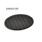 A plain round silicone coaster with a mug of hot coffee, preventing heat damage.